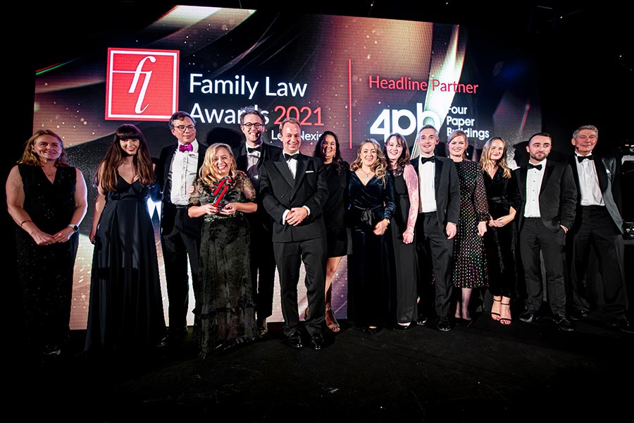 The Forsters' Family team pick up their Law Firm of the Year trophy.
