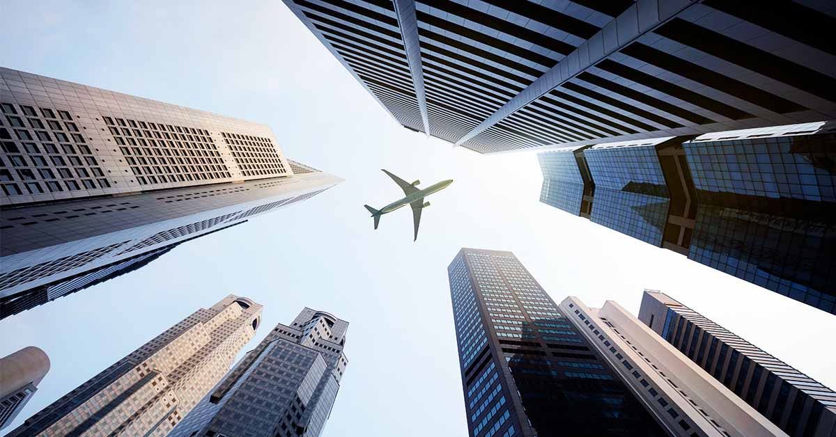 Corporate law graphic - Plane flying over skyscrapers