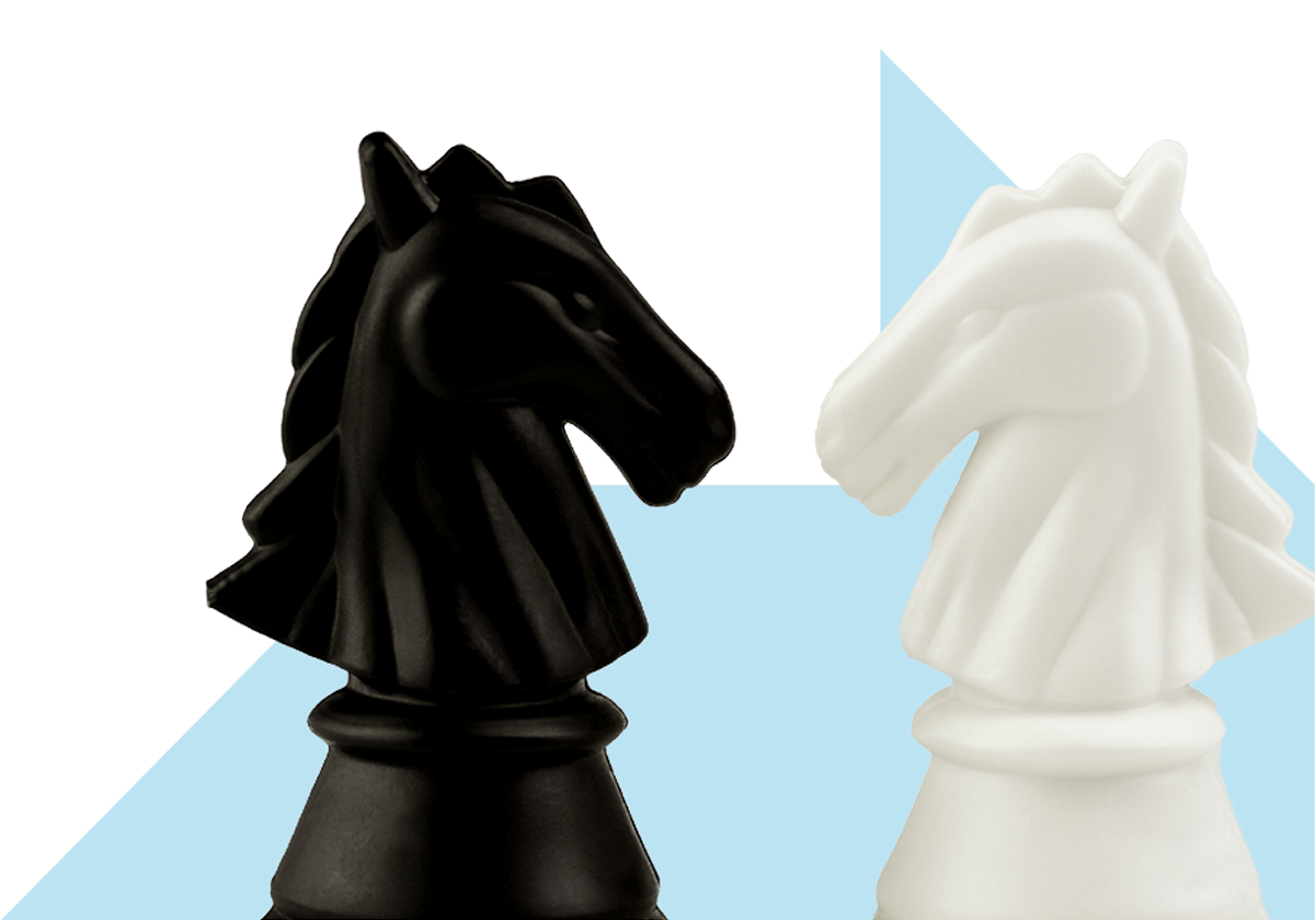A black and a white knight chess piece face each other against a light blue background, suggesting a classic chess confrontation.